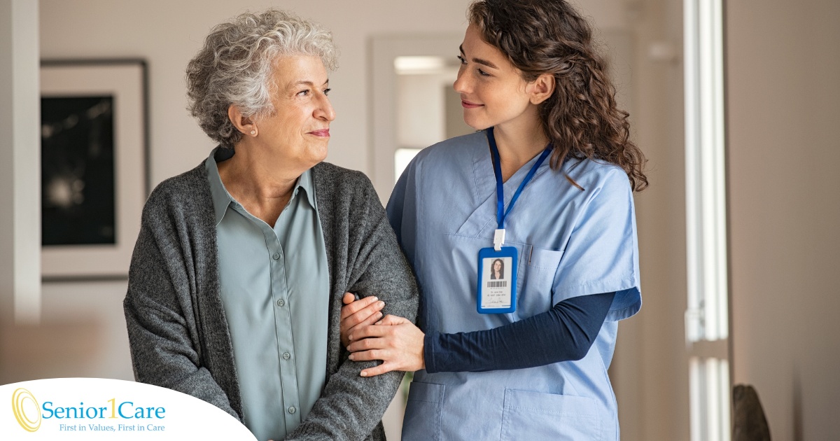 A caregiver and client smile at each other as the caregiver helps the client, representing emotional intelligence in caregiving.