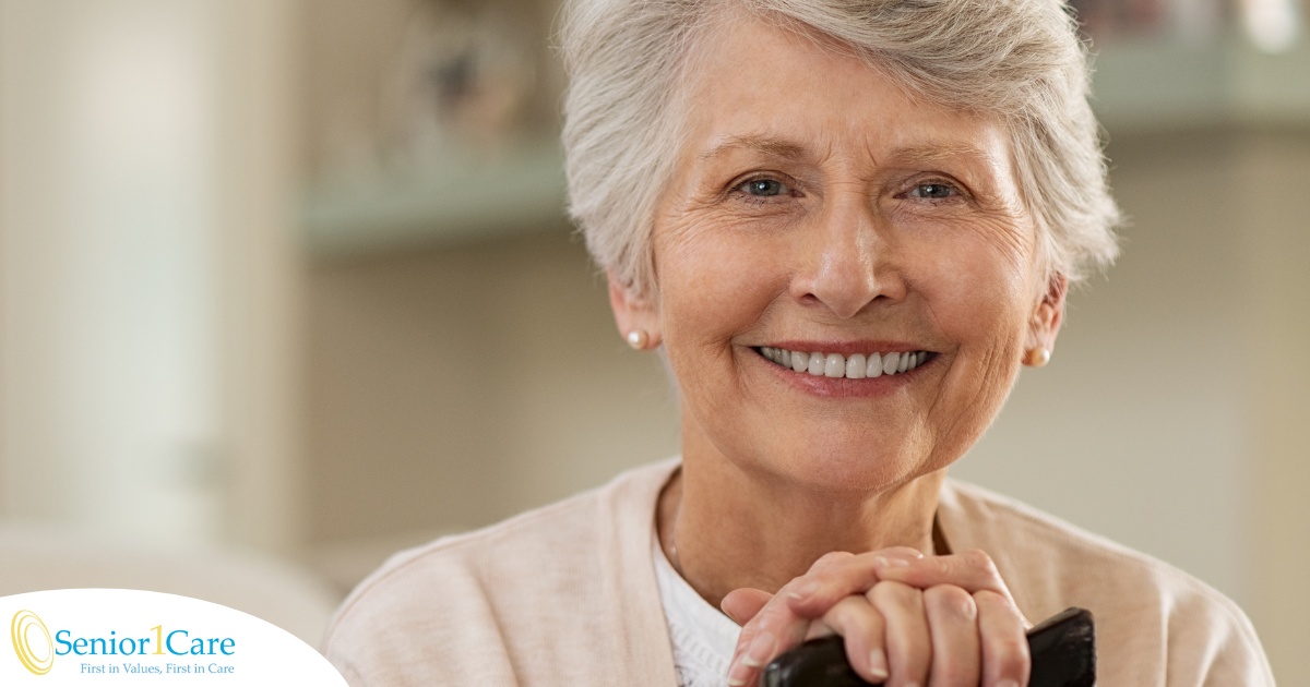 An older woman with healthy teeth smiles, representing good dental hygiene.