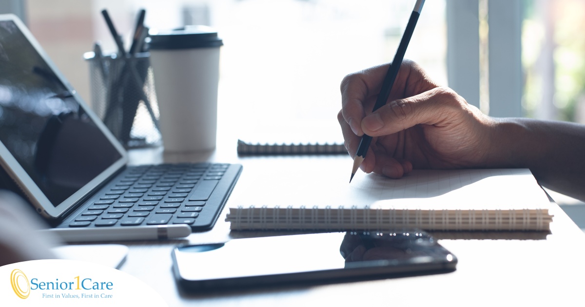 A man studies, representing how professional caregivers should continue to try and learn.